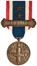 The arms emblazoned onto the reverse side of the Medal for Fidelity to France&nbsp;[fr], instituted in 1922