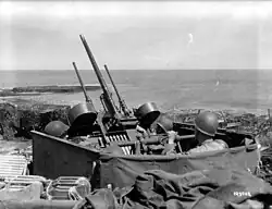 A half-track shooting at several aircraft after Normandy.