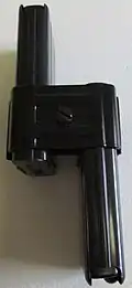 Two 15-round M1 Carbine magazines attached by a clip.