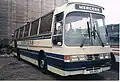 Duple Goldliner IV on Leyland Tiger chassis, with the alternative roof profile incorporating a destination/name display over the windscreen and optional flat glazing.