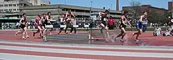 Image 22Men traversing the water jump in a steeplechase competition (from Track and field)