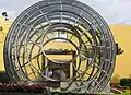 Diquís stone sphere inside a glass and steel spherical structure at the main entrance of Museo Nacional de Costa Rica.