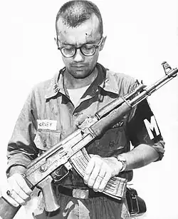 A US Army MP inspects a Chinese Type 56 (an AK-47 derivative) recovered in Vietnam, 1968