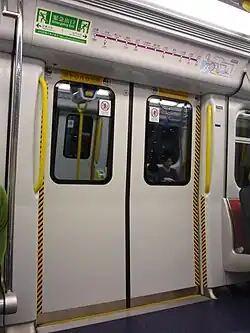 Train doors of an un-refurbished West Rail line SP1900