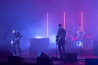 Interpol performing in 2018; from left to right: Daniel Kessler, Paul Banks, and Sam Fogarino