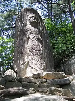 The carved image of the standing Buddha (마애불입상) on Gayasan, Hapcheon, South Korea.