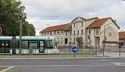 A tram on the T2 tramway line, outside the former Hôtel de Ville (now demolished) in Bezons