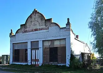 The old Majorca store, established in 1866 and later abandoned. Destroyed by fire in 2015.