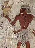 A painting from TT86 depicting a foreign man carrying a vase