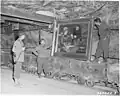 The painting was brought along with other pictures from the German National Gallery to a mine to protect it from the bomb war in World War II. This 1945 photograph shows US soldiers with the painting in the Merkers salt mine.