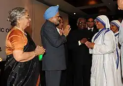 Indian pime minister Manmohan Singh meeting nuns from the Missionaries of Charity at a reception for the Indian community hosted by the Indian high commissioner, in Dar es Salaam, Tanzania on 26 May 2011. Gursharan Kaur, the Indian minister for external affairs, S.M. Krishna, and Indian high commissioner K.V. Bhagirath are also seen.
