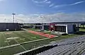 Manning Field at John L. Guidry Stadium and Boucvault Athletic Complex, Gaubert Oil Practice Facility at Shaw Sports Turf/Manning Field (background)