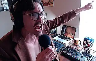 Rebillet performing in a YouTube video in his Dallas apartment, July 2019
