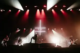 Marilyn Manson performing at Aragon Ballroom in 2024. From left to right: Reba Meyers, Piggy D., Marilyn Manson, Gil Sharone (background) and Tyler Bates