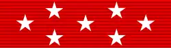 Red ribbon with seven white stars: a row of three stars across the center, and rows of two stars above and below