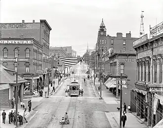 Front Street around 1909. The Marquette County Savings Bank Building is in the middleground at right