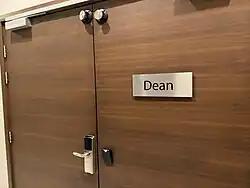 Room door with sign reading "Dean".
