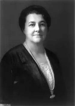 Photograph of a middle-aged woman in dark clothing