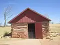 This half-dugout (1888) in Dickens County was removed from the Matador Ranch to the NRHC.