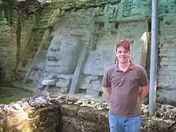 5&nbsp;ft 8 in tall person in front of Mask Temple wall, for perspective.