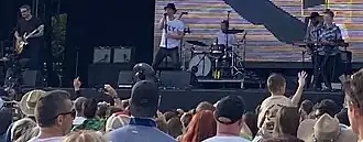 Maxïmo Park performing in 2025. From left to right: Duncan Lloyd (guitar), Paul Smith (vocals), Tom English (drums), Andrew Lowther (bass), and Jemma Freese (keyboards)