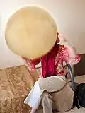 A woman playing a Daf