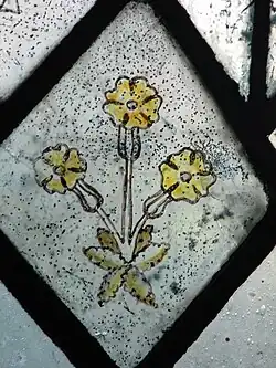 Detail of the medieval glass in the second lancet on the north side of the chancel