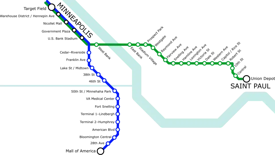 A simple transit diagram with a green line stretching roughly left to right (west to east) and a blue line stretching roughly top to bottom (north to south). A light blue river runs from the top right to the bottom right, roughly following the shape of a ladle. Another thinner waterway runs straight from center-left to connect with the river near the center of the image.