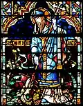 Glass painting of Saint Clément piercing Graoully in the Metz Cathedral