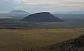 Middle Butte (center) and Big Southern Butte (upper left) rise above the Snake River Plain as seen from East Butte