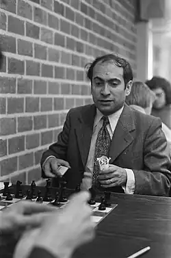 Tal sitted on a table, just before or after a game