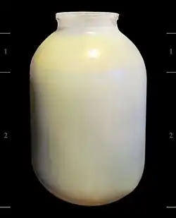A jar containing milk and heavy cream