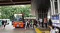 Passangers boarding a Minitrans bus at Tebet Transit Hub, which integrates with the Tebet KRL Commuterline station.