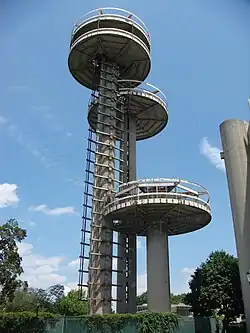 The observation towers in 2009. There are three towers of varying height, all of which are abandoned. There is a scaffold next to the tallest tower.