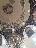 The historical ceiling of the mosque of which parts of the frescoes got lost and had to be restored