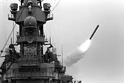 Battleship USS Missouri launching a Tomahawk missile