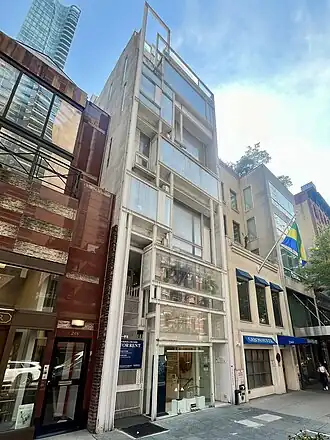 Exterior of the building as seen in 2024, after the fifth and sixth floors were built