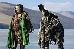 Shamans preparing themselves to perform a rite at the Blue Pearl Festival at Lake Khövsgöl, in Khövsgöl Province