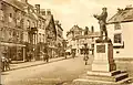 Punch house shown on the right of the Rolls Statue. The picture taken in 1910 also shows a plain wall where a window is now.