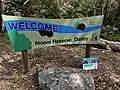 Entry sign to Moore Reserve from Asquith Street, Oatley, 2025