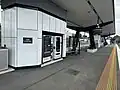 The vending machines and seating on the western end of Platform 1, October 2024