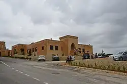 New block beside the entrance gate of the monastery housing a wine shop and a small museum