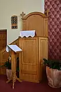 Modern pulpit right next to the altar