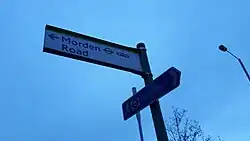 A sign directing passengers to Morden Road tram stop, or Morden tube station.