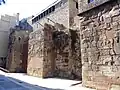 An uncovered section of wall along Carrer de la Tapineria