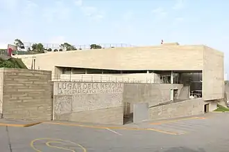 Modern white museum building with geometric design