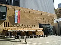 Main entrance to the Museum of Sydney. Note the outline of the First Government House foundations built into the pavement.