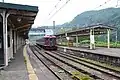 A Shinano Railway 115 series train at platform 2 in June 2015