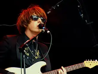 Blaine Harrison of Mystery Jets performing in 2011.