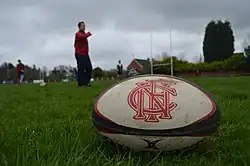 A rugby ball with the Northern Football Club crest printed on